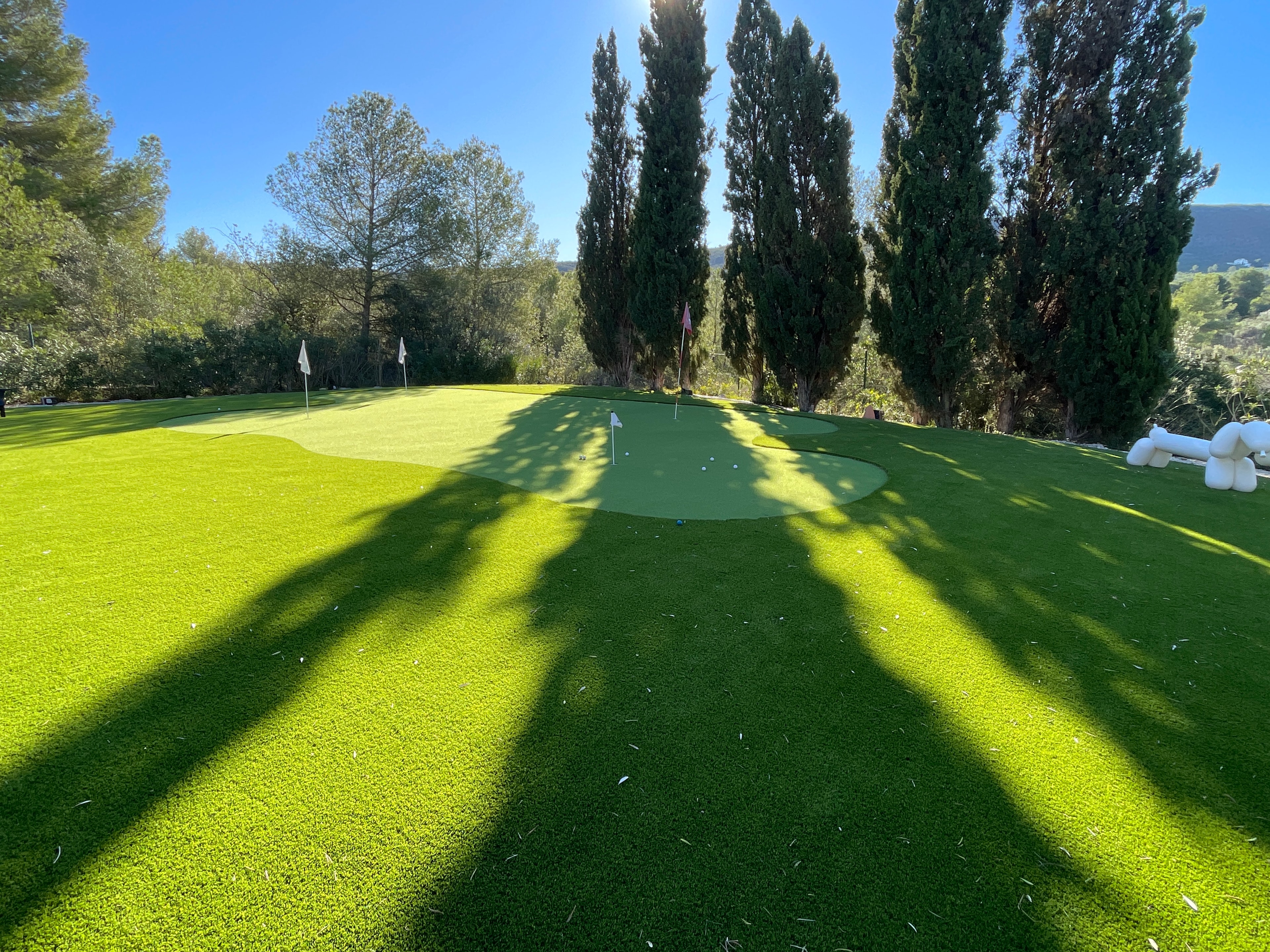 Dual flag putting green artificial grass Spain