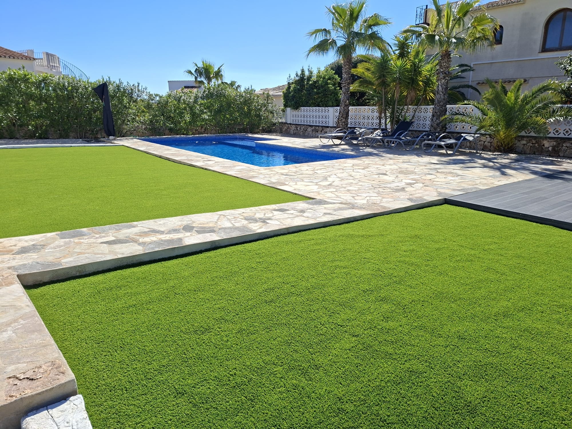 Large pool garden with artificial grass and palm trees Costa Blanca