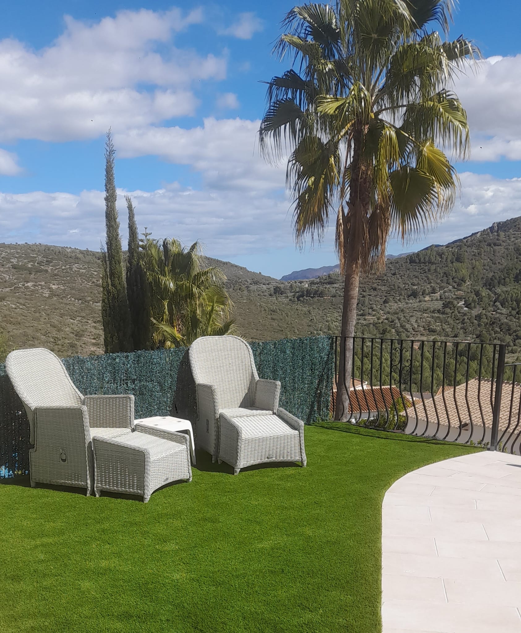 Artificial grass terrace with palm trees and mountain views Costa Blanca